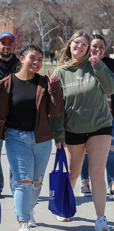 students walk across campus